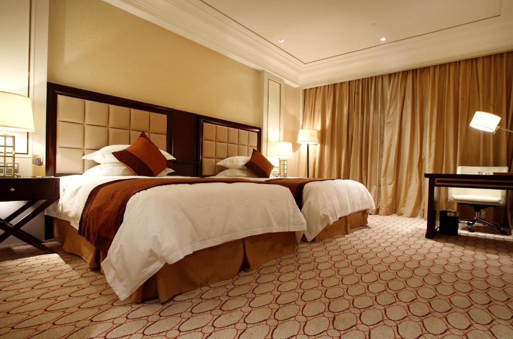 Landison Green Town Hotel Xinchang Номер фото