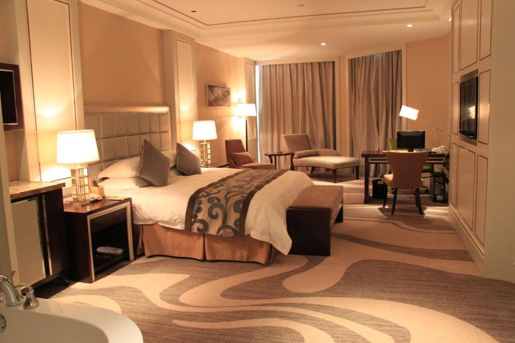 Landison Green Town Hotel Xinchang Номер фото